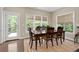 Cozy dining area with wooden table set and views of the outdoor deck at 344 Nottingham Dr, Marietta, GA 30066