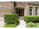 Charming home entrance featuring manicured bushes and a stone walkway at 344 Nottingham Dr, Marietta, GA 30066
