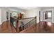 Spacious hallway features hardwood floors, wood banister, and views to a study at 344 Nottingham Dr, Marietta, GA 30066