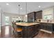 Spacious kitchen with center island, barstool seating, and access to the outdoor deck at 344 Nottingham Dr, Marietta, GA 30066