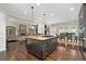 Open floor plan with kitchen island seamlessly connecting to the living and dining areas at 344 Nottingham Dr, Marietta, GA 30066