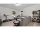 Comfortable living room features a large sectional couch and a treadmill for easy exercise at 344 Nottingham Dr, Marietta, GA 30066