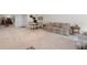 Open-plan living room with carpet, dining area, and couches with neutral tones at 344 Nottingham Dr, Marietta, GA 30066