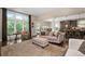 Bright living room features large windows offering ample natural light and lovely outdoor views at 344 Nottingham Dr, Marietta, GA 30066