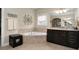 Bright bathroom features a corner tub, vanity, and tile floors at 344 Nottingham Dr, Marietta, GA 30066