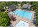 Large community swimming pool surrounded by lounge chairs, featuring a kiddie pool area and well-maintained landscaping at 344 Nottingham Dr, Marietta, GA 30066