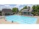 Aerial view of a community swimming pool with lounge chairs, cabana area, and well-kept buildings at 344 Nottingham Dr, Marietta, GA 30066