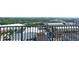 Scenic city view from a balcony overlooking commercial buildings and lush greenery at 361 17Th, Chattahoochee Hills, GA 30363