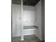 Close up of the built-in desk area with white cabinets and mosaic backsplash in this stylish condominium at 361 17Th, Chattahoochee Hills, GA 30363