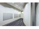 Mailboxes and curved hallway with modern design and neutral color scheme at 361 17Th, Chattahoochee Hills, GA 30363