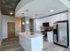 Modern kitchen featuring stainless steel appliances, a center island with a marble countertop, and pendant lighting at 361 17Th, Chattahoochee Hills, GA 30363