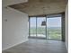 Bright living room featuring luxury vinyl plank flooring and large windows showcasing a green, scenic view at 361 17Th, Chattahoochee Hills, GA 30363