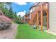 Landscaped backyard with stairs leading to a raised deck, perfect for entertaining outdoors in style at 4924 Locklear Way, Marietta, GA 30066