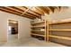 Spacious unfinished basement featuring exposed ceiling and wooden shelving for ample storage space at 4924 Locklear Way, Marietta, GA 30066