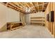 Unfinished basement showing the exposed ceiling, concrete floor, and wooden framing on the walls at 4924 Locklear Way, Marietta, GA 30066
