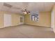Spacious carpeted basement with drop ceiling and fan at 4924 Locklear Way, Marietta, GA 30066
