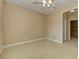 Neutral bedroom with ceiling fan and view to landing at 4924 Locklear Way, Marietta, GA 30066