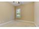 Neutral-toned bedroom with soft carpet, crown molding and natural light, creating a serene and inviting atmosphere at 4924 Locklear Way, Marietta, GA 30066