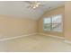 Bright bedroom with neutral paint and carpet, complemented by a ceiling fan and natural light at 4924 Locklear Way, Marietta, GA 30066
