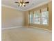 Spacious bedroom featuring neutral carpeting, ceiling fan, and large windows at 4924 Locklear Way, Marietta, GA 30066