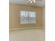 Bedroom features neutral paint, a fan, carpet, and a window overlooking a neighborhood at 4924 Locklear Way, Marietta, GA 30066