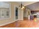 Dining room features hardwood floors, with stairs and kitchen nearby at 4924 Locklear Way, Marietta, GA 30066