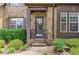 Close-up of a home's front entrance with a black front door at 4924 Locklear Way, Marietta, GA 30066