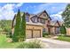 Charming two-story home with a stone facade and a two-car garage at 4924 Locklear Way, Marietta, GA 30066