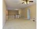 A bright hallway with carpet and white railings overlooks stairs, providing an open and airy feel at 4924 Locklear Way, Marietta, GA 30066