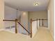 A spacious hallway features white railings and a stairwell, creating an airy transition space at 4924 Locklear Way, Marietta, GA 30066