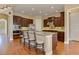Gourmet kitchen boasts a center island, granite countertops, and stainless-steel appliances at 4924 Locklear Way, Marietta, GA 30066