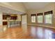 Open-concept living room with hardwood floors, windows, and open to kitchen at 4924 Locklear Way, Marietta, GA 30066