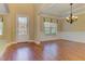 Sun-filled living room boasts beautiful hardwood floors and detailed trim at 4924 Locklear Way, Marietta, GA 30066