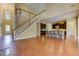 Open living area with hardwood flooring and view of the kitchen with breakfast bar at 4924 Locklear Way, Marietta, GA 30066