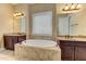 Luxurious main bath features a soaking tub and dual vanities at 4924 Locklear Way, Marietta, GA 30066