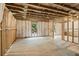 A spacious unfinished basement with a blank canvas, insulated walls, and natural light from windows at 6045 Stargazer Way, Cumming, GA 30028