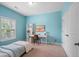 Well-lit bedroom featuring a desk and closet space at 6045 Stargazer Way, Cumming, GA 30028