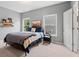 Cozy bedroom features carpet, two windows offering natural light, with a comfortable bed and modern decor at 6045 Stargazer Way, Cumming, GA 30028