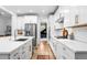 Bright and modern kitchen with white cabinets, stainless steel appliances, and stylish fixtures at 6045 Stargazer Way, Cumming, GA 30028