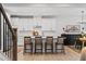 Modern kitchen featuring white cabinets, stainless steel appliances, and an island with seating at 6045 Stargazer Way, Cumming, GA 30028