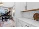 Bright living area with a black grand piano and views of the landscaped yard at 6045 Stargazer Way, Cumming, GA 30028