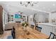 Open living space featuring hardwood floors, fireplace, built-in shelves and view to breakfast area at 6045 Stargazer Way, Cumming, GA 30028