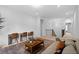 Open loft space with built-in desks, cozy seating area, and view of staircase at 6045 Stargazer Way, Cumming, GA 30028