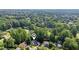 Aerial view of the home, highlighting its neighborhood location surrounded by mature trees and manicured lawns at 6841 Fairway Ridge Dr, Douglasville, GA 30134
