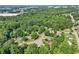 Aerial view highlighting the home's location amid lush greenery and neighborhood streets, offering a tranquil setting at 6841 Fairway Ridge Dr, Douglasville, GA 30134