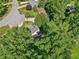 Aerial perspective showcasing a house nestled among lush trees in a serene neighborhood setting at 6841 Fairway Ridge Dr, Douglasville, GA 30134