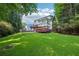 Expansive backyard featuring tiered decks with lush greenery and ample space at 6841 Fairway Ridge Dr, Douglasville, GA 30134