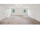 Bedroom with carpeting, closet with louvered doors, and two windows at 6841 Fairway Ridge Dr, Douglasville, GA 30134