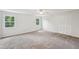 Bedroom with carpeting, closet with louvered doors, and two windows at 6841 Fairway Ridge Dr, Douglasville, GA 30134