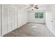 Bedroom with carpeting, closet with louvered doors, and ceiling fan at 6841 Fairway Ridge Dr, Douglasville, GA 30134